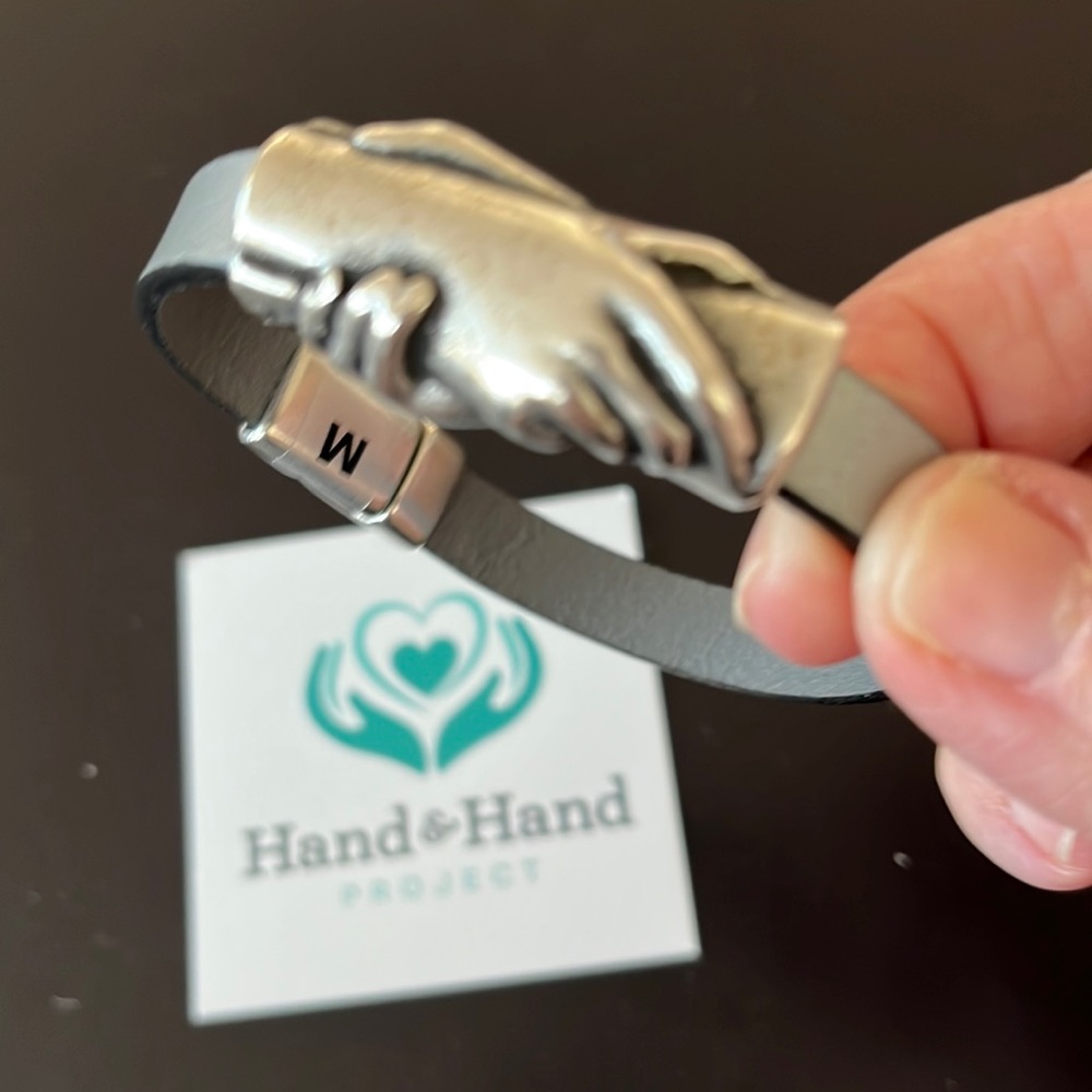 Silver hand in hand medium bracelet never been worn.
